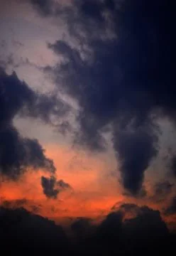 Beautiful clouds on sunset sky Stock Photos