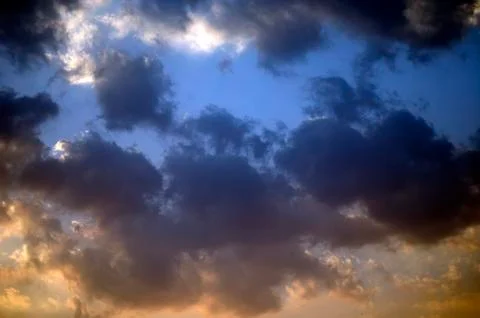 Beautiful clouds on sunset sky Stock Photos