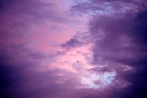 Beautiful clouds on sunset sky Stock Photos