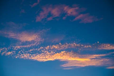 Beautiful clouds at sunset. Sunlight Stock Photos