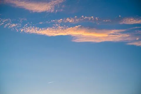 Beautiful clouds at sunset. Sunlight Stock Photos