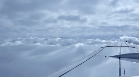 Beautiful clouds through an airplane window Stock Footage 43648610