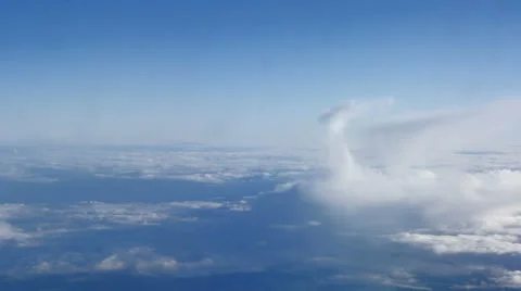 Beautiful clouds through an airplane window (LR Pan, No 3) Stockbeeldmateriaal 63883903