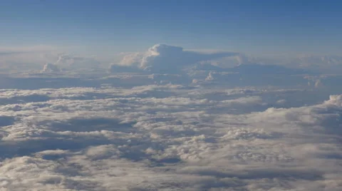 Beautiful clouds through an airplane window (LR Pan, No 4) Stock Footage 63884551