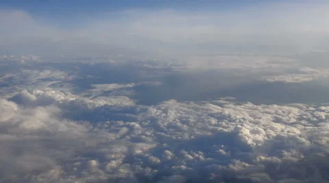Beautiful clouds through an airplane window (RL Pan, No 6) Stock Footage 63885331