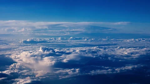 Beautiful clouds through an airplane window - LR Pan Stock Footage 67578590