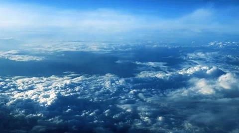 Beautiful clouds through an airplane window - LR Pan Stock Footage 67578755