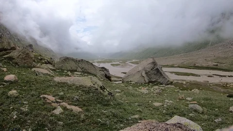 BEAUTIFUL clouds timelapse flowing over the mountains. Stock Footage 125310763