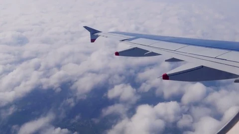 Beautiful clouds view from the window of the plane Stock Footage 75805193