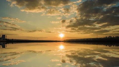 Beautiful cloudscape and sunset breaking through cloud over lake reflection. god Stock Footage 163679673