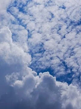 Beautiful cloudscape with dense white clouds against clear blue sky 스톡 사진