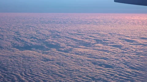 Beautiful Cloudscape in the evening from an airplane window 18000 ft above Stock Footage 270506483