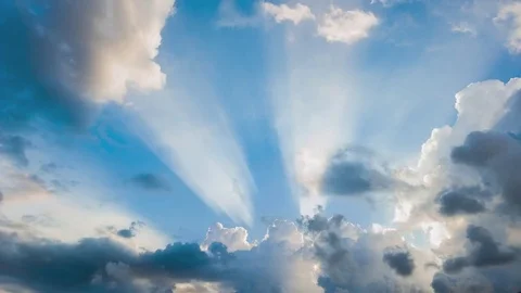 Beautiful cloudscape with large, building clouds and sunrise breaking through cl 스톡 동영상 77111265