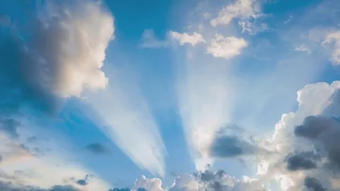 Beautiful cloudscape with large, building clouds and sunrise breaking through cl Stock-Footage 77111278