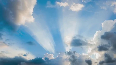 Beautiful cloudscape with large, building clouds and sunrise breaking through cl Stock-Footage 77111286