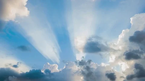 Beautiful cloudscape with large, building clouds and sunrise breaking through cl Stockbeeldmateriaal 77111300