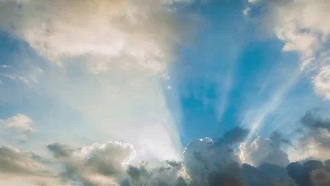 Beautiful cloudscape with large, building clouds and sunrise breaking through cl Stock-Footage 77111302