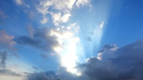 Beautiful cloudscape with large, building clouds and sunrise breaking through cl Stockbeeldmateriaal 77115670