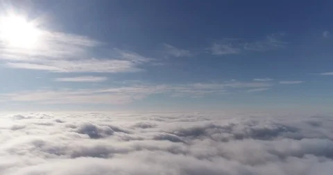 Beautiful cloudscape with large, building clouds and sunrise breaking through Vídeos de archivo 84179219