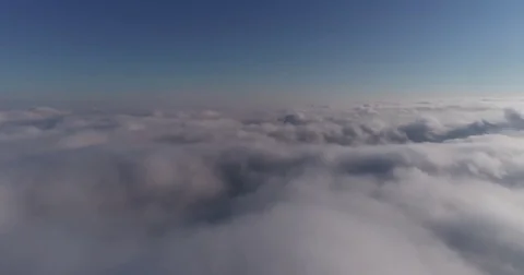 Beautiful cloudscape with large, building clouds and sunrise breaking through Vídeos de archivo 84179229