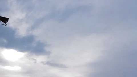 Beautiful cloudscape with large building clouds and sunrise breaking through Stock Footage 98215452