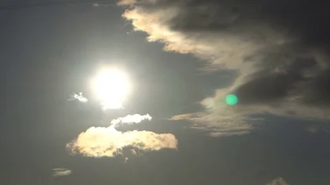 Beautiful cloudscape with large clouds and sunrise breaking through cloud mass 库存影片 81873541
