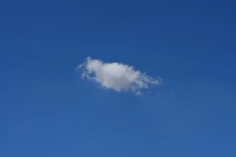 Beautiful cloudscape of nature single white cloud only one on blue sky back.. 库存照片
