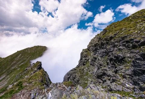 Beautiful cloudscape over the cliffs of Fagarasan Photos