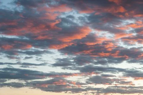 Beautiful cloudscape as the sun rises in the early morning Stock Photos