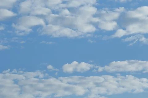 Beautiful cloudy blue sky. Light white cloud and blue sky background.  Stock Photos