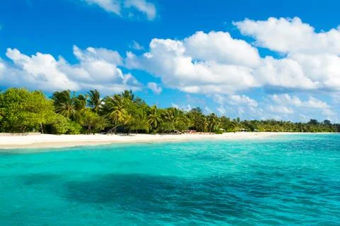 Beautiful cloudy panoramic landscape of sandy beach in Indian ocean, Maldives Stock Photos