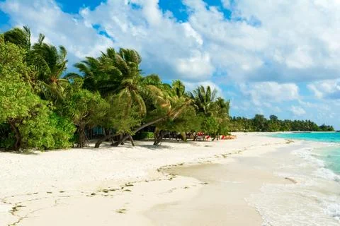 Beautiful cloudy panoramic landscape of sandy beach in Indian ocean, Maldives Stock Photos