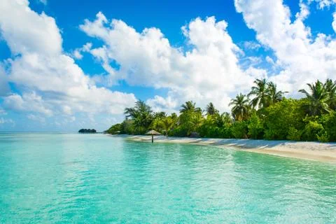 Beautiful cloudy panoramic landscape of sandy beach in Indian ocean, Maldives Stock Photos