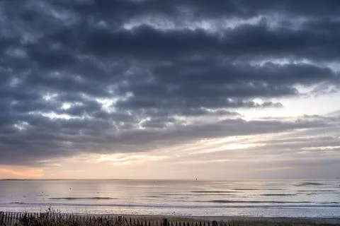 Beautiful cloudy seascape with dramatic sky. Rivedoux plage, Re island, Franc Stock Photos
