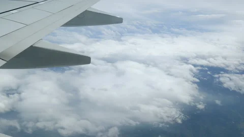 Beautiful cloudy sky from aerial view. Sunrise clouds from airplane window  스톡 동영상 112735989