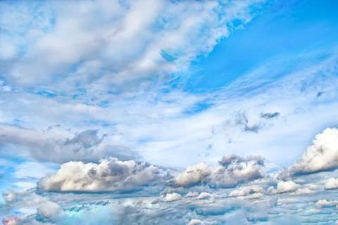 Beautiful cloudy sky with cumulus clouds. Summer dramatic cloudscape Stock Photos
