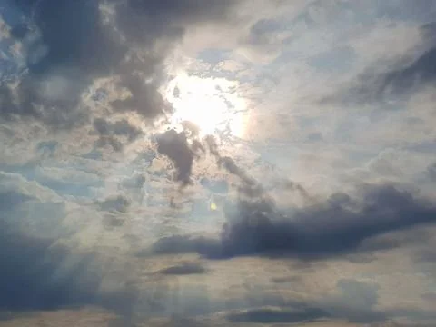 Beautiful Cloudy Sky With the Sun Rays Stock Photos
