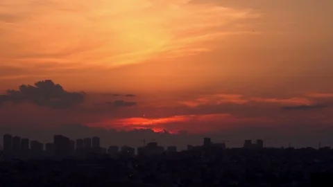 Beautiful cloudy sky at sunset over city Stock Footage 76756936