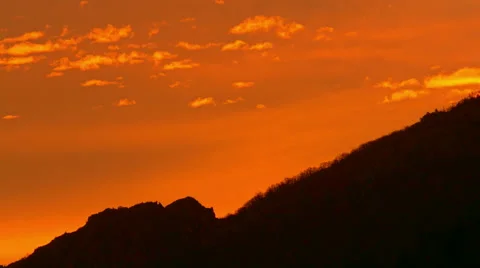 Beautiful cloudy sunrise time lapse in the mountain, 4K HDR shot Stock Footage 58740159