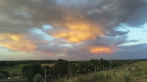 Beautiful cloudy sunset - Drone camera moves forward, up, and left Stock Footage 134833846
