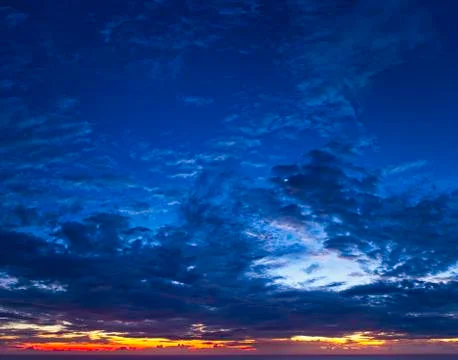 A beautiful cloudy sunset over the distant horizon Stock Photos