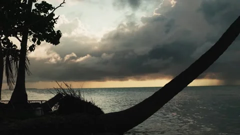 Beautiful cloudy sunset over tropical sea. In the background of it is the Sandy Stock Footage 264472486
