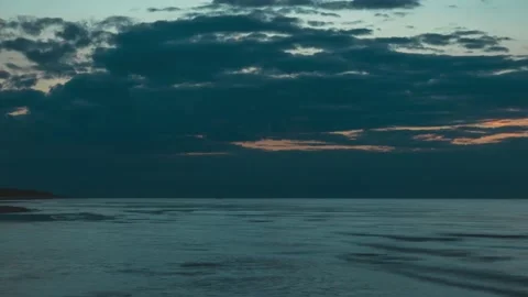 Beautiful cloudy sunset with a ship receding into the distance at sea Stock Footage 145812380