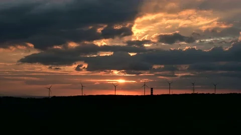 Beautiful cloudy sunset with wind towers Stock Footage 154427318