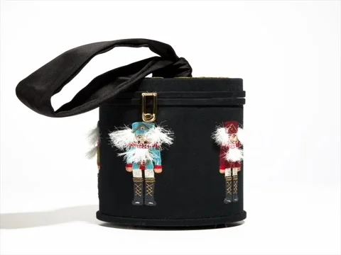 Beautiful clutch tube with decor, revolves on a white background Stock Footage 80336680