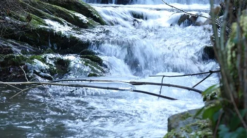 Beautiful cold mountain stream with icicles Video stock 70356005