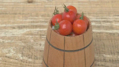 A Beautiful Collection of Fresh Cherry Tomatoes Displayed in a Rustic Wooden Stockbeeldmateriaal 287826385