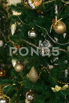 Beautiful color christmas decorations hanging on christmas tree with shiny glare Stock Photos