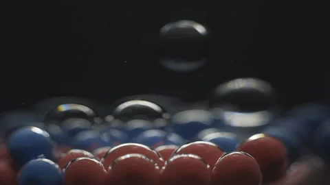Beautiful colored bubbles in a liquid on a black background. Close-up. Slow Stock Footage 97852899