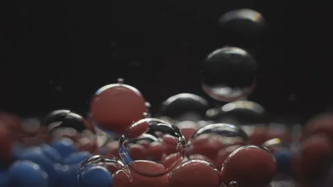 Beautiful colored bubbles in a liquid on a black background. Close-up. Slow Video stock 97852957